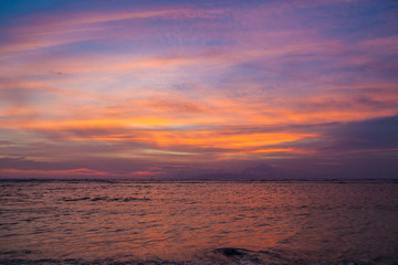 Beautiful sunset over the sea and volcano Agung silhouette on the island of Gili Trawangan, Indonesia