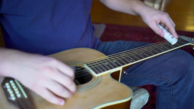 Six string slide guitar with pvc slider.