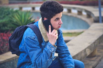 Young man talking mobile phone