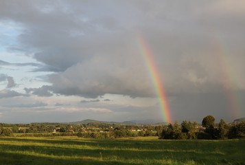 Beautiful landscape with rainbow. Czech typical summer landscape.