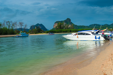 motor boats in the lagoon overlooking the beautiful mountains
