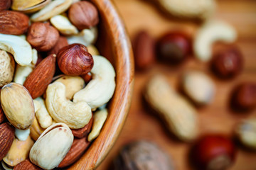 Assorted nuts in wooden bowl