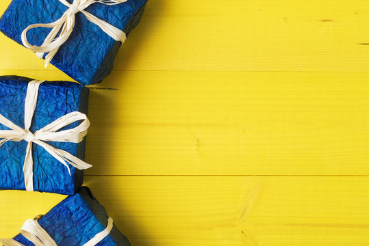 Close up of gift boxes over yellow background