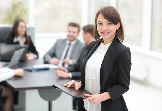 confident young business woman with documents