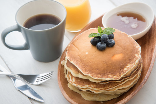 Isolated Blue Berry Pancake With  Syrup And Drink