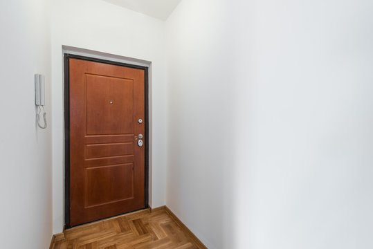 Close up of closed wooden door in empty room