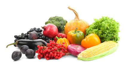 Ripe fruits and vegetables on white background