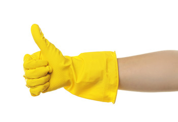Female hand in rubber glove giving thumb up, isolated on white