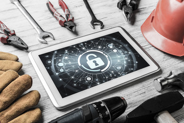 Web security and technology concept with tablet pc on wooden tab © adam121