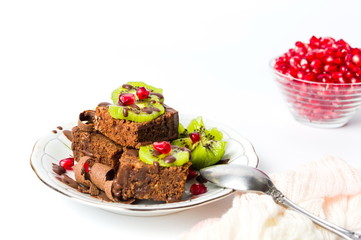 Chocolate cake with kiwi and pomegranate