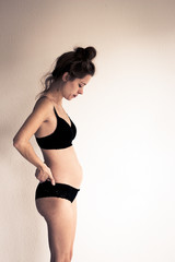Obraz premium young pregnant woman in underwear