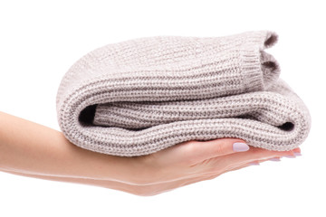 Warm sweater beige folded female hand