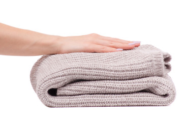 Warm sweater beige folded female hand