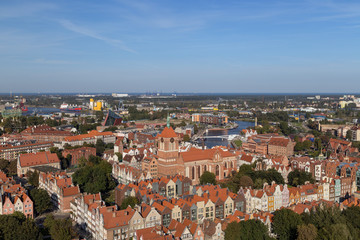Fototapeta na wymiar Old residential buildings and St. John's Church at the Main Town (Old Town) in Gdansk, Poland, viewed from above on a sunny day.