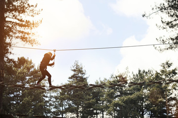 woman crossing high wires
