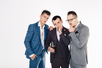 Isolated image of handsome young men with a bottle of whiskey