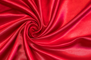 The red fabric is formed in the form of a rose.