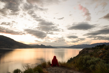 Girl enjoying the Sunset overlooking the okanagan lake in Penticton british columbia Canada