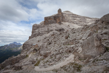 Tilt shift effect of  Cantore mountain hut and first world war ruines in the middle of expanse of cyclopean boulders near Fontananegra Pass, Tofane, Dolomites, Italy