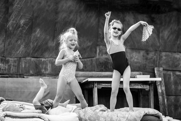 children playing in the courtyard of a house in the village