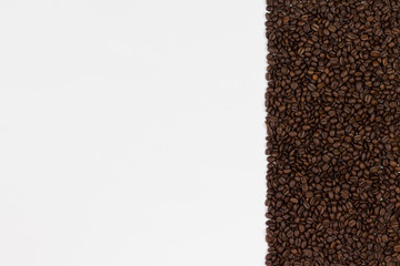 Coffee beans on white background. Top view with space for your text.