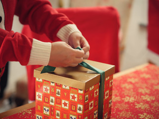 Preparing a Christmas gift box