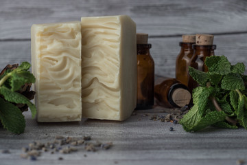 White handmade soap with mint and bottles