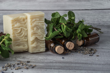 White handmade soap with mint and bottles