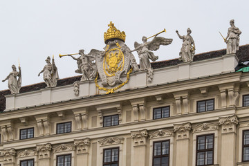 Fototapeta na wymiar Vienna, Austria December 31, 2013: Figures on the outside of the Michaelertrakt, Hofburg, Vienna