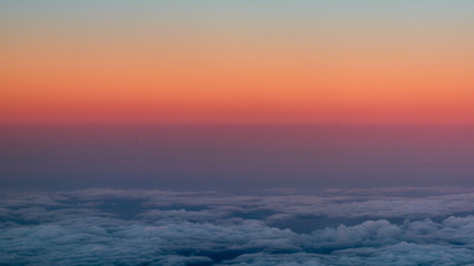 Naklejka na ściany i meble sunset view from an airplane window