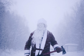 Moody Santa with axe in hands.