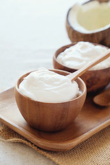 homemade organic coconut greek yogurt in wooden bowl