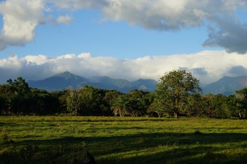 Fototapeta na wymiar Clouds and mountains with lush tropical vegetation in countryside Panama