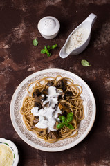 Dark spaghetti with mushrooms