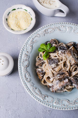 Dark spaghetti with mushrooms