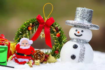 Santa claus and Gift box, Snow man on snow background. Christmas steering wheel, Red ribbon on winter background. Delivering happy holidays. Use for wallpaper.