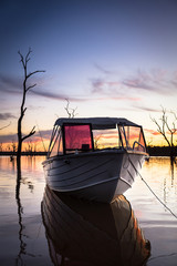 Obraz na płótnie Canvas Sunrise Boat