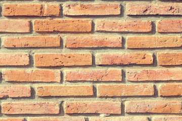 Obraz premium Old grunge brick wall background, Common sight in the local city. Use for design and texture. Vintage tone.