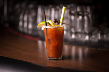 Bloody Mary cocktail with garish on bar counter