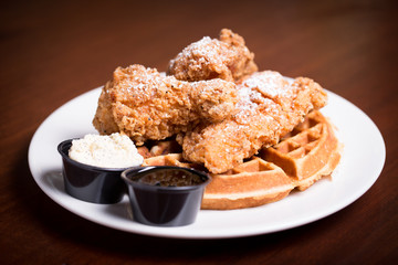 Fired chicken and waffles with powdered sugar 