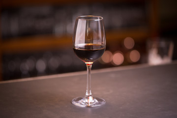 Glass of red wine at a bar