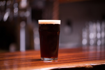 Beer pint close up at bar 