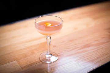 overhead view of grapefruit and orange cocktail on bar