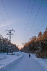Obraz premium High-voltage pole in the winter at sunset