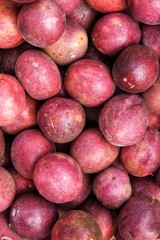 close up of fresh purple passion fruits harvest from farm