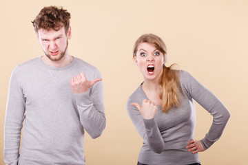 Young emotional couple arguing.