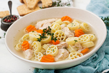 Dietary soup with turkey or chicken fillet with pasta Ruote and herbs
