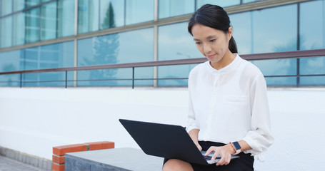 Young business woman use of laptop computer
