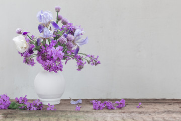 flowers in vase on background  white wall