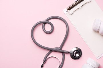 Medical concept. Stethoscope and pill. Top view.